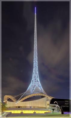 The 162-metre tall steel spire and the wrap-around base of The Victorian Arts Centre at Southgate. Designed by architect Sir Roy Grounds, the centre opened in 1982.    The spire is illuminated with 6,600 metres of optic fibre tubing, 150 metres of neon
