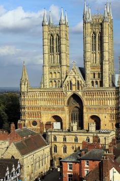 
                    
                        Lincoln, England; English Renaissance style.  Here you can see a cathedral built of stone.  On the top two levels you can see cresting along the top edges.  The arch in the center looks like a gothic-tudor arch.
                    
                