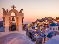 
                    
                        Summer Sunsets-Picture of buildings along a cliff in Santorini, Greece
                    
                