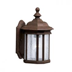 Traditional-style design. Aluminum construction in a variety of finishes. Clear-seedy glass panel. Accommodates (1) 100W medium base bulb (not included). Available in variety of sizes. The Kichler Kirkwood 90 Outdoor Wall Lantern, with its transitional design, blends well with traditional as well as modern decors. Featuring cast aluminum construction, this lantern is built to last for many years. Its body displays beautiful moldings that give it an irresistible vintage appeal. Apart from this, seedy glass diffuser further adds to its appearance and utility. You can effectively use this lighting fixture to light up your porch, terrace, balcony or doorway. Kichler QualitySince 1938, Cleveland-based Kichler Lighting has been known for their innovative designs and excellent craftsmanship. Kichler is the world's leading decorative lighting fixture company and the winner of four ARTS Lighting Manufacturer of the Year awards. Kichler designers travel the world to discover the latest trends in exterior and interior style, colors, and designs. They then translate the best of those trends into fixtures that will bring beauty, pleasure, and light into your home. Kichler fixtures stand the test of time and are functional works of art that you're sure to treasure. Size: 6.5 in. Color: Tannery Bronze.