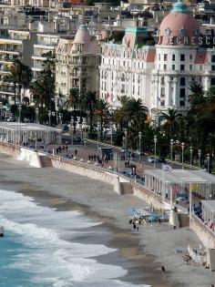 Promenade des Anglais, Nice, France--funny thing is-the dress code for that hotel with the pink dome roof restricted folks but wearing shorts in the lobby of the hotel---but on the beach across the street, you could go topless.  Always found that strange!