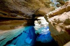 Enchanted Well at Chapada Diamantina in Bahia, Brazil. Located at Chapada Diamantina National Park, this well’s water is 120 feet deep and is clear enough to see the rocks. (27 Surreal Places to Visit Before You Die)