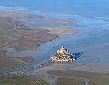 Mont Saint-Michel at low tide. The parking lot and causeway have now been removed to make it an island again.