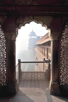 Agra, India.  Magic early morning light and fog at the Red Fort...