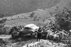 People bringing a vehicle to Kathmandu c. 1946. Before the construction of The Tribhuvan Highway in 1956, vehicles had to be carried through old route of Bhimbhedi-Kulekhani-Chitlang- Changdragiri pass and Thankot before it reached the valley.The history of Transportation in Nepal can be viewed here. Source:Old Nepal - Photos  Images