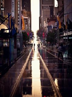 A great shot of Collins Street, Melbourne. Following the vertical lines as the composition is a great way to do street photography.