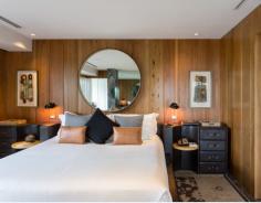 The gorgeous wood paneled walls give this hotel room a beachy feel in the SLS Hotel South beach in #Miami.