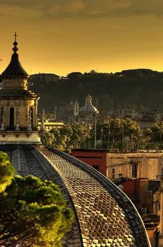 The sun setting over Rome, Italy.