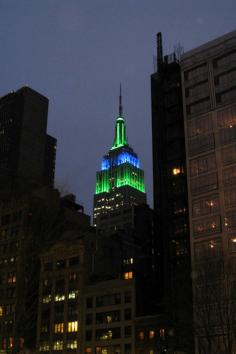 Green and Blue Empire State Building at night, NYC, United States.