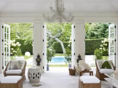 All white and rattan decor feels summery and classic. Photo Credit: Simon Upton. "Beauty At Home" Random House.