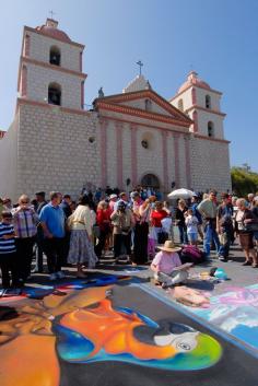 i madonnari - italian street painting festival at Santa Barbara Mission. Madonnari, or street painters, transform the Mission plaza using pastels on pavement to create 150 vibrant and colorful, large scale images.