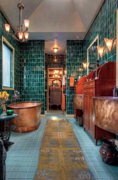 An Art Nouveau Town House Makeover  "In the master bath, a copper soaking tub could almost be floating amid the watery setting of teal, green, and bronze tile. Kathryn designed the custom mahogany cabinetry and handmade copper sinks."