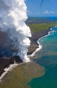 Lava flowing into the ocean with steam plume, The Big Island, Hawaii. It is amazing to see the ocean boiling like this.