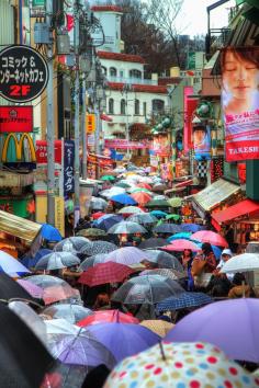 Wonderful, colorful photo of umbrellas on a narrow street in Tokyo