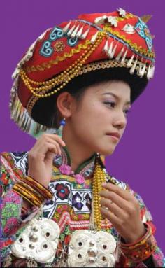 China |  Yi people have a tradition of wearing colorful headgear | A Yi woman's headgear reveals her age and social identity | To read more click on the image. © Women of China