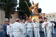Priests carry the icon of St. Publius through the streets in Floriana, Malta