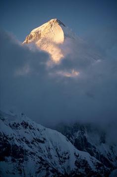 Khan Tengri; it is 22,999 feet tall. Khan Tengri is part of the Tengri Tag mountain range which means 'Heavenly Mountain'. The mountain was found in 1847 by a Russian explorer who went by the name Pyotr Petrovich Semenov-Tyan-Shansky, though no one ever was able to successfully climb it until 1931 by a Ukraine team lead by Mikhail Pogrebetsky.