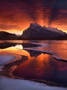 An amazing sunrise light show outside Banff in the Canadian Rockies © Marc Adamus