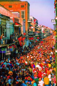 Huge crowd packs Bourbon Street on Fat Tuesday, Mardi Gras, New Orleans, Louisiana USA
