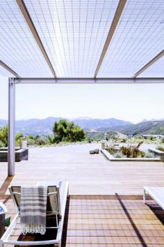 Take a Stroll Through a Malibu Marvel Tucked Into the Mountains | DomaineHome.com // Modern sun deck on a mountain home