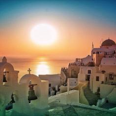 Stunning sunset over Oia. Photo courtesy of pindropchaos on Instagram.