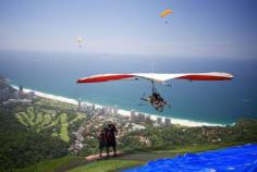 
                        
                            Hang glide over Rio de Janeiro .
                        
                    