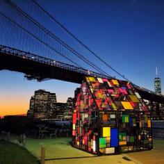 Brooklyn Bridge Park, New York City, New York - Stained glass house by Tom Fruin at Brooklyn Bridge Park at sunset.