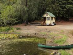 
                        
                            Fully embrace the great outdoors in the privacy of this mini, creekside cabin, complete with an outdoor hammock and picnic table.
                        
                    