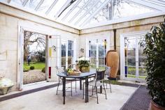 Inside a Grand, Art-Filled Manor in Bath // Conservatory With Stain Glass Windows