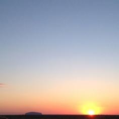 
                        
                            The setting sun looks so small against Uluru's endless sky. Photo courtesy of sarajeanz on Instagram.
                        
                    
