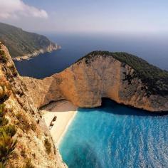 Island Inspiration! Take in the rocky cliffs and glittering sea of Navagio Beach, Zakynthos. See our list of even more beautiful beaches to visit this year.