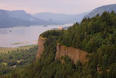 
                    
                        The Crown Point Vista House in the Columbia River Gorge. Beacon Rock is visible in the background, above and to the left of the Vista House; Hamilton Mountain is to the left of Beacon Rock.
                    
                