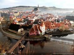 This photo was captured at noon on December 25, 2013, from the castle which is located on the edge of the small town and is the perfect viewpoint for the panorama of the almost intact historical town.  Location: Český Krumlov, South Bohemian, Czech Republic