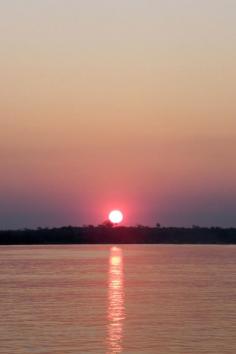 
                    
                        Sunset over the Zambezi river, Zambia.
                    
                