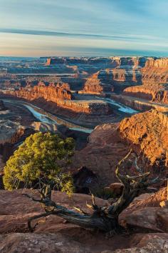 U.S. Overlook at Dead Horse Point, Moab, Utah. Dead Horse Point State Park is a state park featuring a dramatic overlook of the Colorado River and Canyonlands National Park. The park is so named because of its use as a natural corral by cowboys in the 19th century