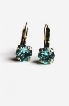 
                    
                        Turquoise swarovski crystal earrings hand set in a brass setting
                    
                