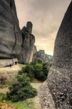 
                    
                        Man in rock formation, Meteora - Greece
                    
                