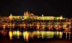 The Prague Castle, Prague, Czech Republic. In the foreground is Vltava River (German: Moldau) and to the right is the famous Charles Bridge.