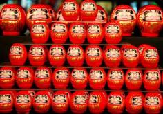 
                        
                            Daruma doll - hollow and round Japanese wish dolls with no arms or legs, modelled after Bodhidharma. Using black ink, one fills in a single circular eye (on the right - for right handers) while thinking of a wish. Should the wish later come true, the second eye is to be filled in.
                        
                    