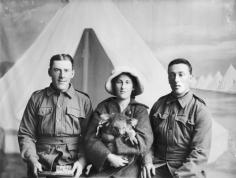 A Salute To Australia's Animal Military Two soldiers and friend with a pet or mascot koala, Broadmeadows Army camp, 1915.Melbourne Australia