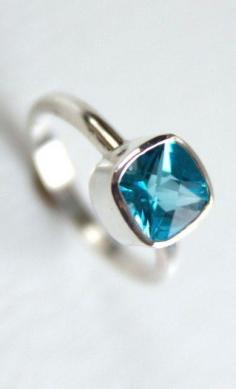 
                    
                        Swiss Blue Cushion Topaz Cut Ring in Recycled Sterling Silver
                    
                