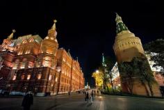 
                    
                        The gorgeously illuminated State Historical Museum and Kremlin, with St. Basil's Cathedral in the distance, by night at Moscow Red Square
                    
                