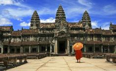 
                    
                        A monk visits the ruins of Angkor Wat in Cambodia.
                    
                