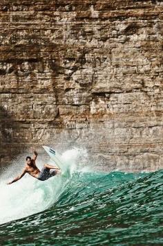 
                    
                        Surfing in Bali.
                    
                