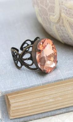 
                    
                        Big Jewel Ring - Oval peach rhinestone with adjustable filigree band
                    
                