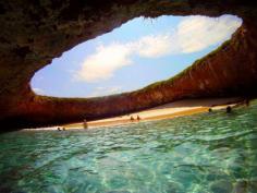 the marieta islands. a water tunnel leads you to this hidden beach. (punta mita expeditions)- bucket list!