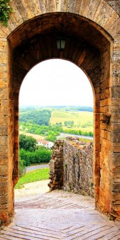 
                    
                        Ancient Defensive Gate of a Beautiful Village in Tuscany, Italy
                    
                