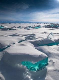 
                    
                        “In March, due to a natural phenomenon, Siberia’s Lake Baikal is particularly amazing to photograph. The temperature, wind and sun cause the ice crust to crack and form beautiful turquoise blocks or ice hummocks on the lake’s surface.” Photograph by Alexei Trofimov
                    
                