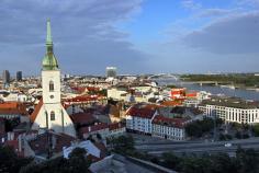 
                    
                        View of St. Martin's Cathedral and city of Bratislava Slovakia from atop Castle Hill at sunset
                    
                