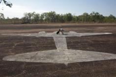 
                    
                        Darwin Australia - Man with dog standing over a painted shape of an aircraft  #australia #darwin #fun #thingstodo #history #outback #4wd #desert #worldwarii #travel #traveltherenext
                    
                